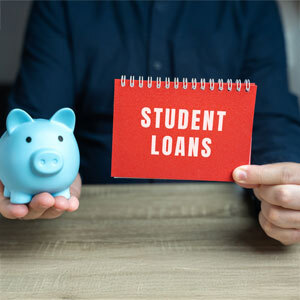 Concept of financial planning for student loans with a piggy bank - Nager Law Group