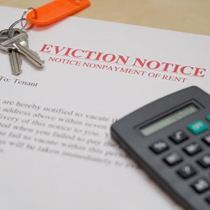 Eviction Notice with keys and calculator - Nager Law Group