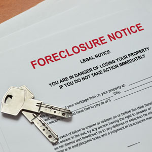 Foreclosure notice displayed alongside a set of keys - Nager Law Group