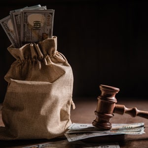 Bag of money with gavel, symbolizing loan modification