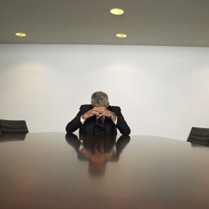 An attorney at a conference table, engaged in discussions about filing bankruptcy