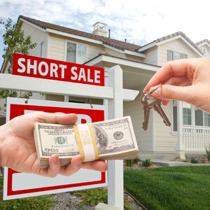 Person exchanging cash for house keys in front of a property with 'Short Sale' sign - Nager Law Group